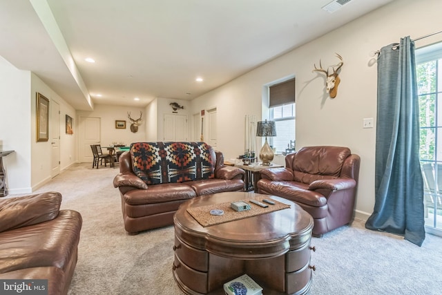 carpeted living room with plenty of natural light, recessed lighting, and baseboards
