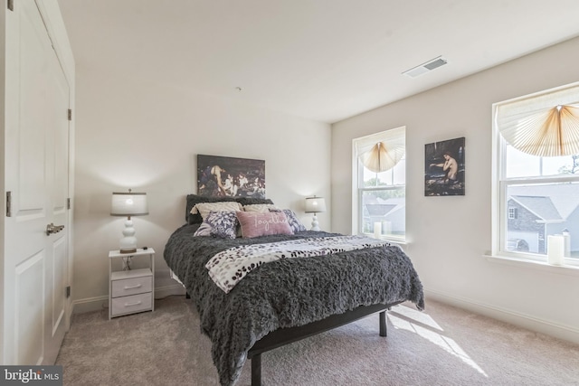 bedroom with carpet and baseboards