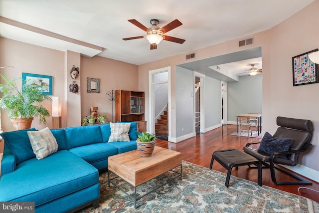 915 Westminster St NW, Washington, DC 20001 - living room with ceiling fan, stairs, wood finished floors, and baseboards