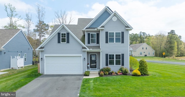 22378 Mahogany Rd, Milton, DE 19968 - view of front of house with asphalt driveway, a front yard, a garage, and a shingled roof
