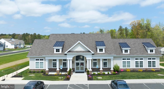 22378 Mahogany Rd, Milton, DE 19968 - view of front of home with uncovered parking, a front yard, and covered porch