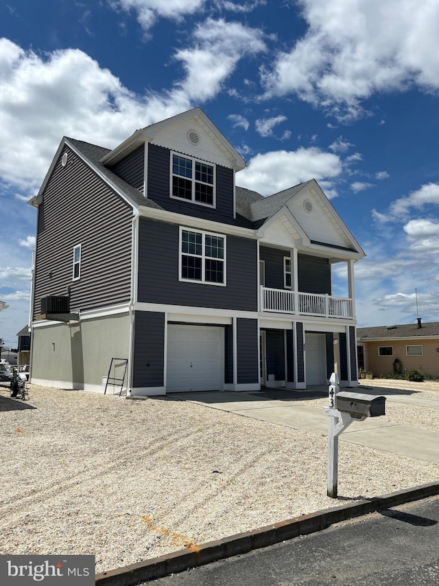 43 W Susquehanna Dr, Little Egg Harbor Twp, NJ 08087 - coastal home featuring an attached garage, driveway, a balcony, and roof with shingles