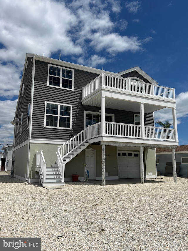 43 W Susquehanna Dr, Little Egg Harbor Twp, NJ 08087 - coastal home with an attached garage, stairway, driveway, and a balcony