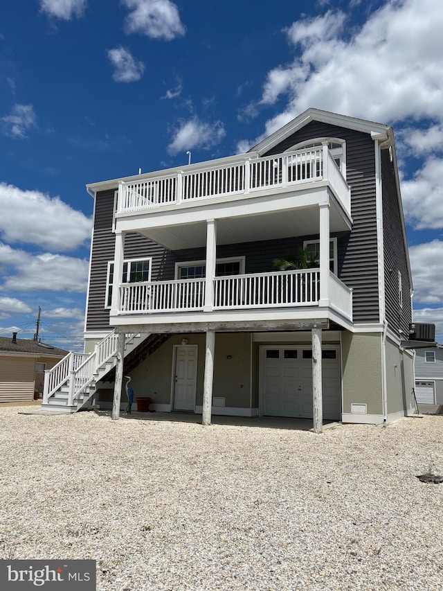 43 W Susquehanna Dr, Little Egg Harbor Twp, NJ 08087 - coastal inspired home featuring a garage, gravel driveway, and stairway