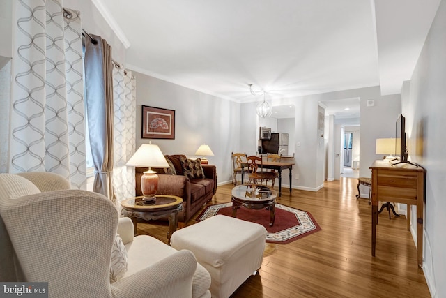 1951 Sagewood Ln Unit 118, Reston, VA 20191 - living area with crown molding, wood finished floors, and baseboards