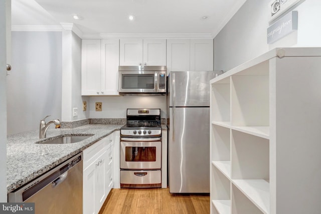 1951 Sagewood Ln Unit 118, Reston, VA 20191 - kitchen with stainless steel appliances, a sink, open shelves, ornamental molding, and light stone countertops