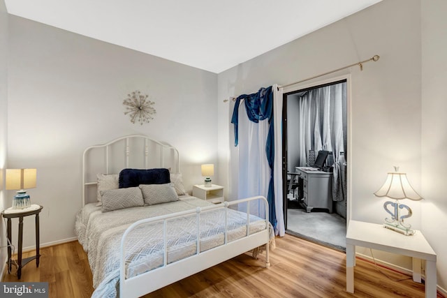 1951 Sagewood Ln Unit 118, Reston, VA 20191 - bedroom with wood finished floors and baseboards
