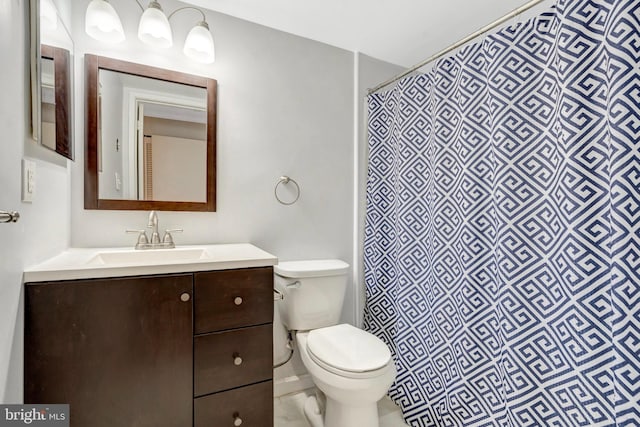 1951 Sagewood Ln Unit 118, Reston, VA 20191 - bathroom featuring toilet, vanity, and a shower with shower curtain