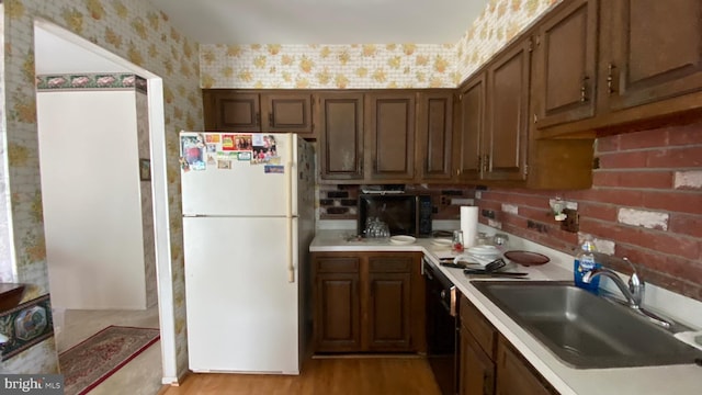 341 Chimney Oak Dr, Joppa, MD 21085 - kitchen featuring freestanding refrigerator, wallpapered walls, a sink, light countertops, and light wood-style flooring