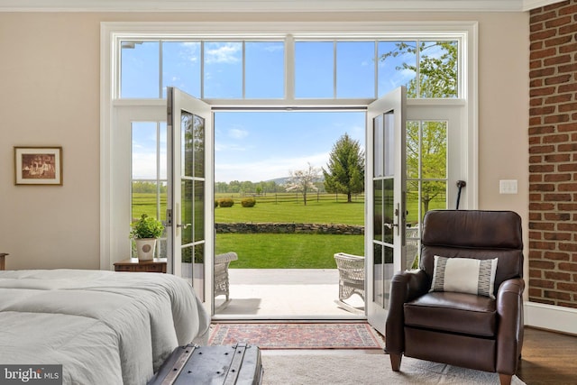 doorway to outside featuring plenty of natural light and wood finished floors