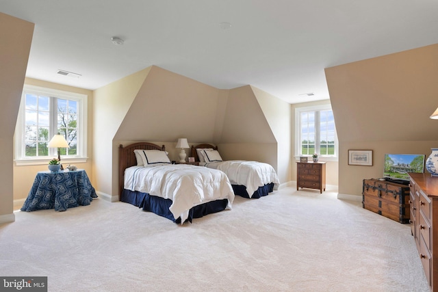 bedroom with multiple windows, baseboards, lofted ceiling, and carpet