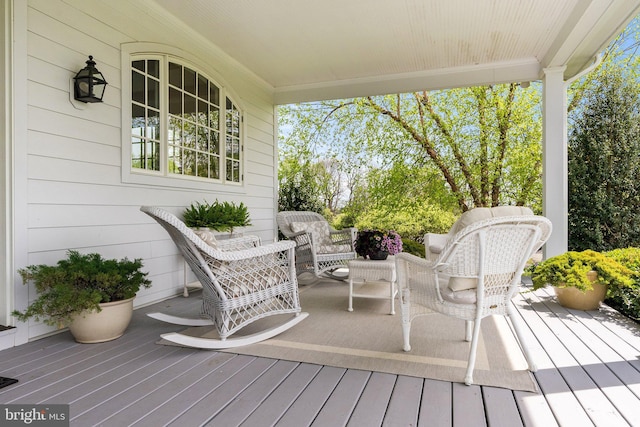 wooden deck featuring covered porch