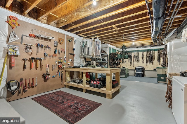 unfinished below grade area with a workshop area