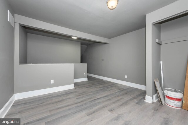 1412 W Baltimore St, Baltimore, MD 21223 - basement featuring baseboards and wood finished floors