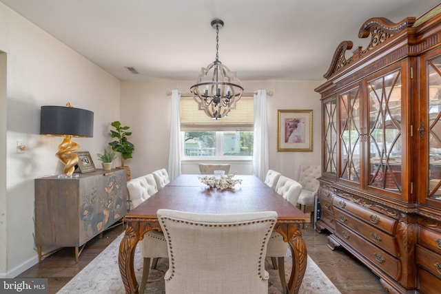 dining room featuring a chandelier and wood finished floors