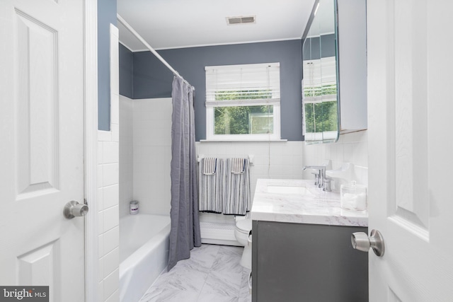 bathroom with tile walls, vanity, toilet, shower / tub combo, and radiator heating unit