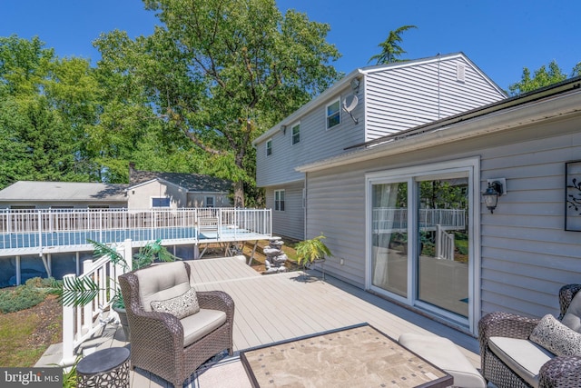 view of patio featuring a deck and an outdoor living space