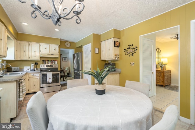 dining space featuring a textured ceiling, a chandelier, light tile patterned flooring, and recessed lighting