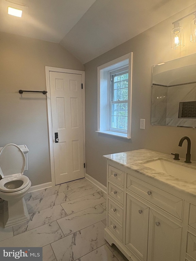 5311 Herring Run Dr, Baltimore, MD 21214 - bathroom featuring marble finish flooring, vanity, toilet, baseboards, and vaulted ceiling