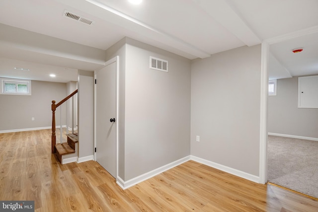 5311 Herring Run Dr, Baltimore, MD 21214 - basement featuring stairs, light wood finished floors, and baseboards