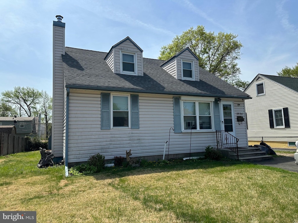 3534 Carnarvon Ave, Bristol, PA 19007 - cape cod home with a front lawn and a chimney