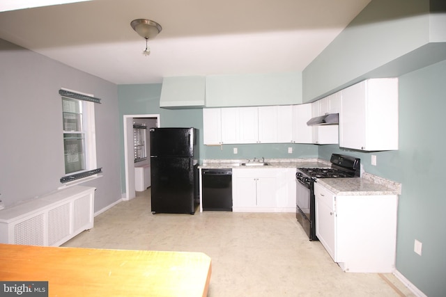kitchen featuring black appliances, under cabinet range hood, a sink, radiator heating unit, and light countertops