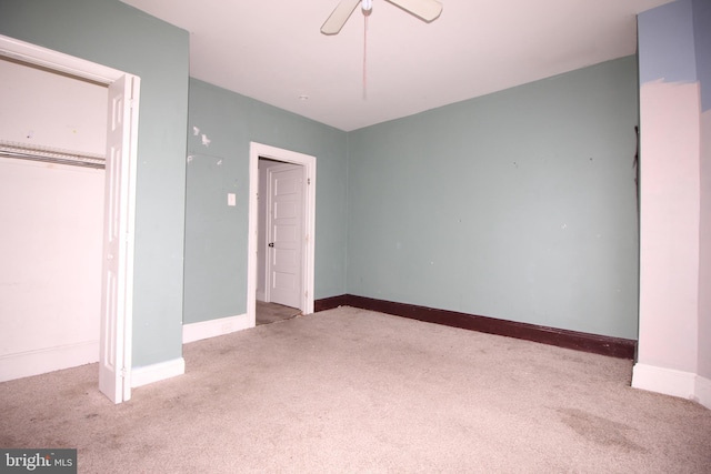 unfurnished bedroom with carpet, baseboards, and ceiling fan