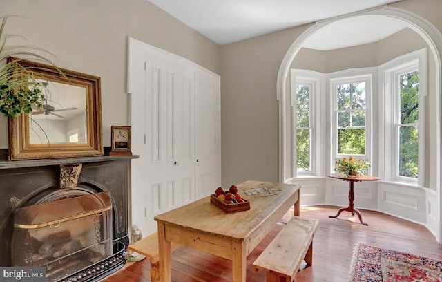 612 Old Rte 322, Spring Mills, PA 16875 - dining area featuring hardwood / wood-style flooring, arched walkways, and a fireplace