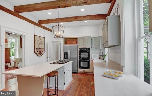612 Old Rte 322, Spring Mills, PA 16875 - kitchen featuring appliances with stainless steel finishes, open shelves, light countertops, a center island, and beamed ceiling