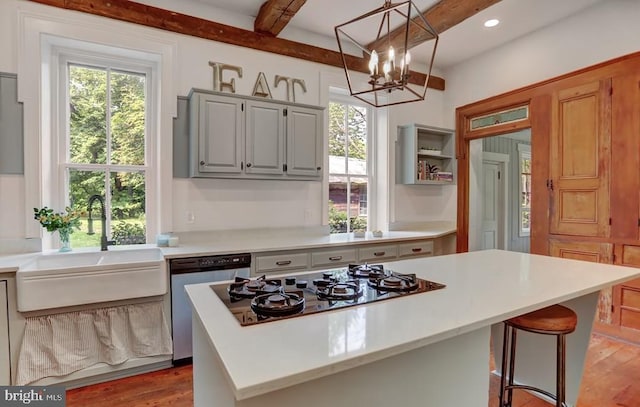 612 Old Rte 322, Spring Mills, PA 16875 - kitchen with black gas stovetop, a sink, stainless steel dishwasher, light countertops, and wood finished floors