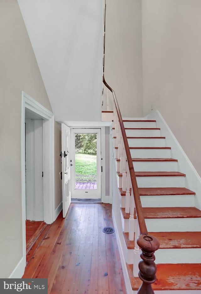 612 Old Rte 322, Spring Mills, PA 16875 - entrance foyer with hardwood / wood-style flooring, stairs, baseboards, and high vaulted ceiling