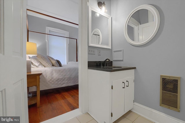 612 Old Rte 322, Spring Mills, PA 16875 - ensuite bathroom with vanity, tile patterned flooring, and baseboards