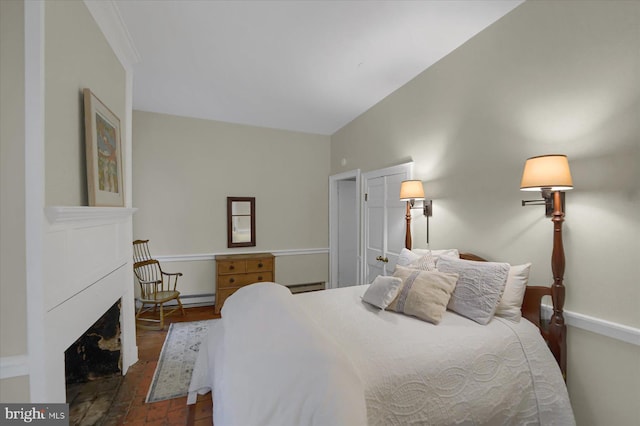 612 Old Rte 322, Spring Mills, PA 16875 - bedroom with a fireplace, a baseboard radiator, and baseboards
