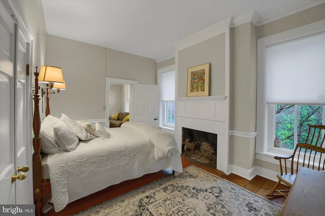 612 Old Rte 322, Spring Mills, PA 16875 - bedroom with wood finished floors, a fireplace, baseboards, and crown molding