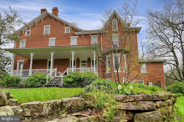 612 Old Rte 322, Spring Mills, PA 16875 - view of front of home with brick siding, a porch, and a chimney