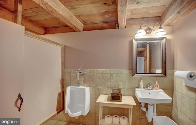 612 Old Rte 322, Spring Mills, PA 16875 - half bathroom with wooden ceiling, beam ceiling, toilet, tile patterned floors, and tile walls