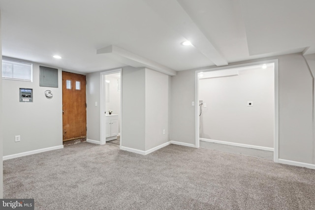 finished below grade area with carpet floors, baseboards, and recessed lighting
