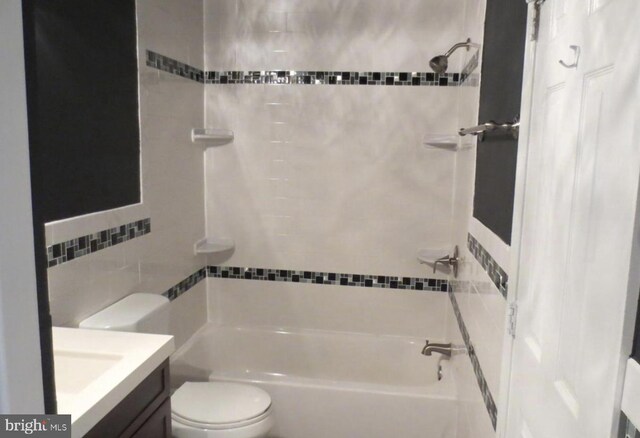 1918 Columbia Ave, Landover, MD 20785 - full bathroom featuring tile walls, toilet,  shower combination, and vanity