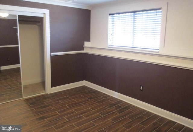 1918 Columbia Ave, Landover, MD 20785 - unfurnished bedroom with dark wood-style flooring, baseboards, and a closet