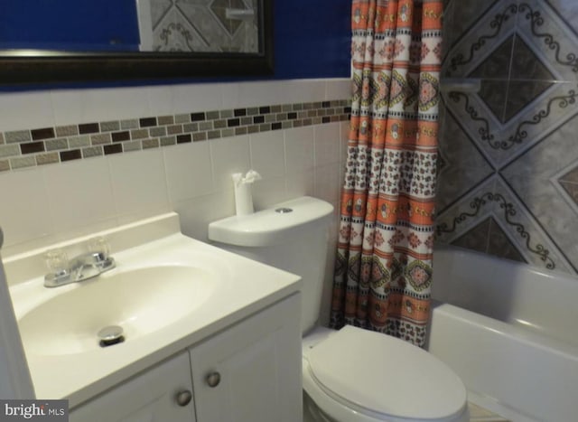 1918 Columbia Ave, Landover, MD 20785 - full bath featuring toilet, vanity, tile walls, and shower / bath combo