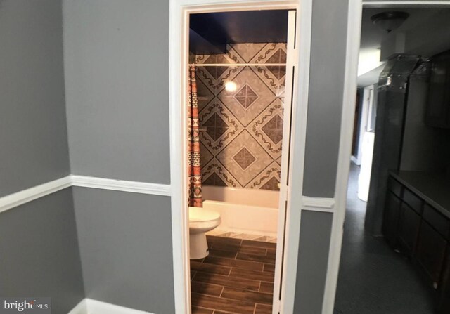 1918 Columbia Ave, Landover, MD 20785 - full bathroom with toilet, wood finished floors, and bathing tub / shower combination