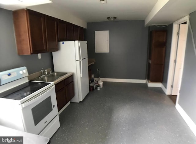 1918 Columbia Ave, Landover, MD 20785 - kitchen with white appliances, a sink, baseboards, light countertops, and dark brown cabinets