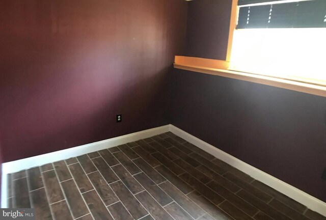 1918 Columbia Ave, Landover, MD 20785 - unfurnished room with baseboards and dark wood-style floors