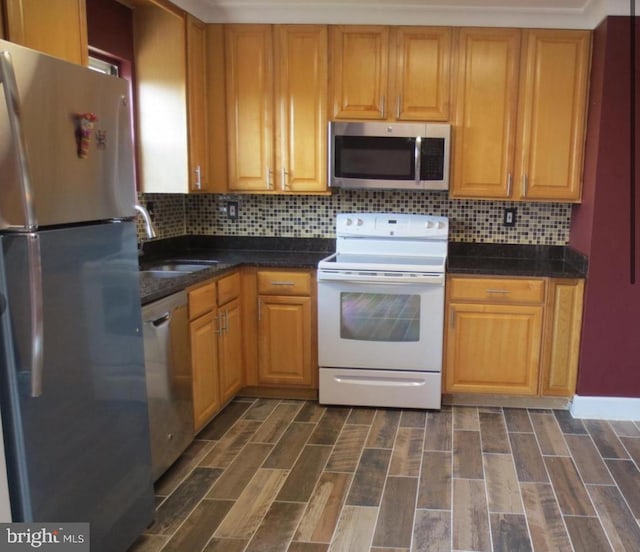 1918 Columbia Ave, Landover, MD 20785 - kitchen featuring stainless steel appliances, a sink, backsplash, and dark wood-type flooring