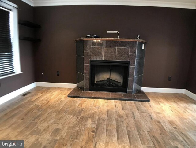 1918 Columbia Ave, Landover, MD 20785 - detailed view of wood finished floors, baseboards, a tile fireplace, and ornamental molding