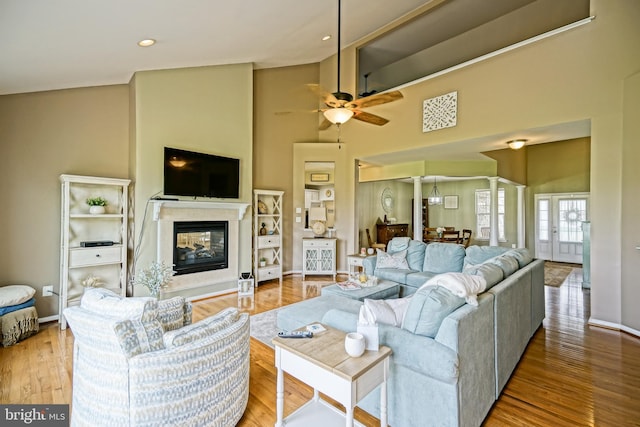 24928 Rivers Edge Rd, Millsboro, DE 19966 - living room with ceiling fan, a high end fireplace, high vaulted ceiling, wood finished floors, and recessed lighting