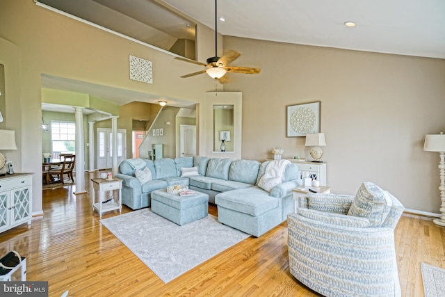 24928 Rivers Edge Rd, Millsboro, DE 19966 - living room featuring ornate columns, ceiling fan, light wood-style floors, and lofted ceiling