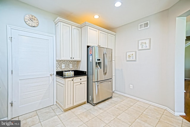 24928 Rivers Edge Rd, Millsboro, DE 19966 - kitchen with stainless steel fridge with ice dispenser, recessed lighting, light tile patterned floors, backsplash, and dark countertops