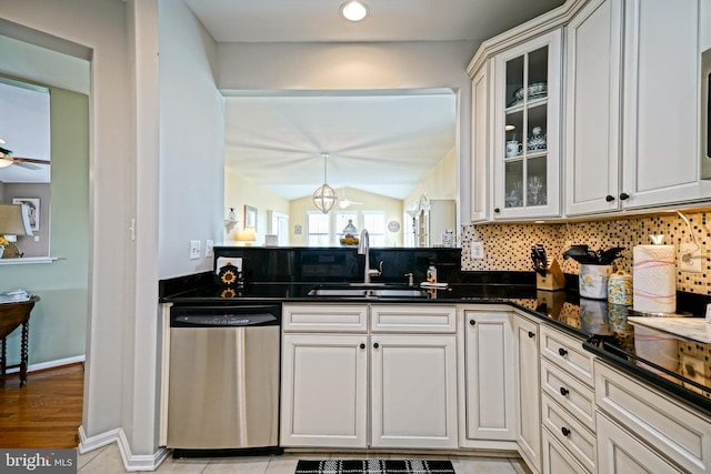 24928 Rivers Edge Rd, Millsboro, DE 19966 - kitchen with dishwasher, tasteful backsplash, vaulted ceiling, glass insert cabinets, and ceiling fan