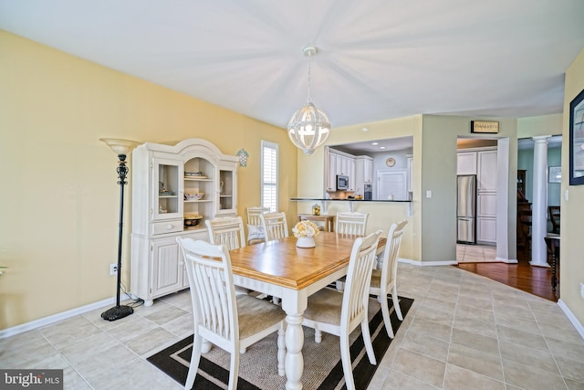24928 Rivers Edge Rd, Millsboro, DE 19966 - dining area with ornate columns and light tile patterned floors